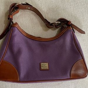 Dooney & Bourke leather handbag in purple. Additional coin purse included.